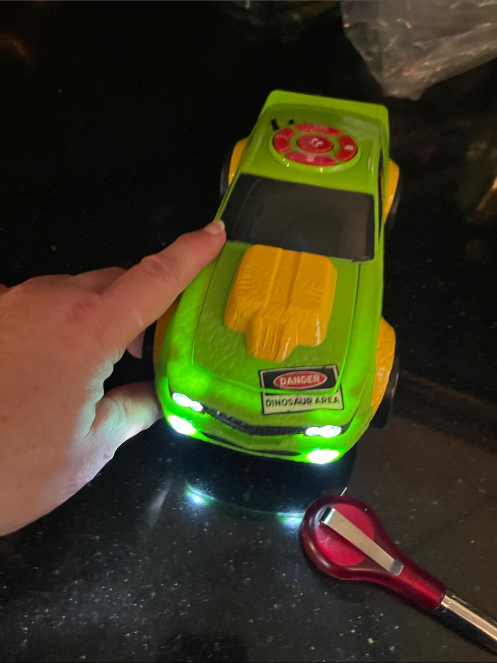 Jurassic park musical turn and go race car with Dino under hood